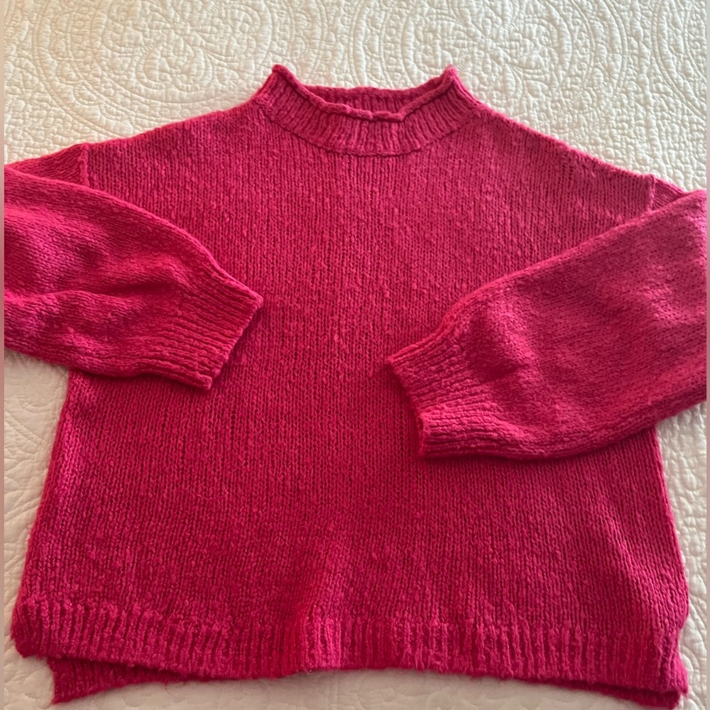 Fuchsia pink bulky sweater.